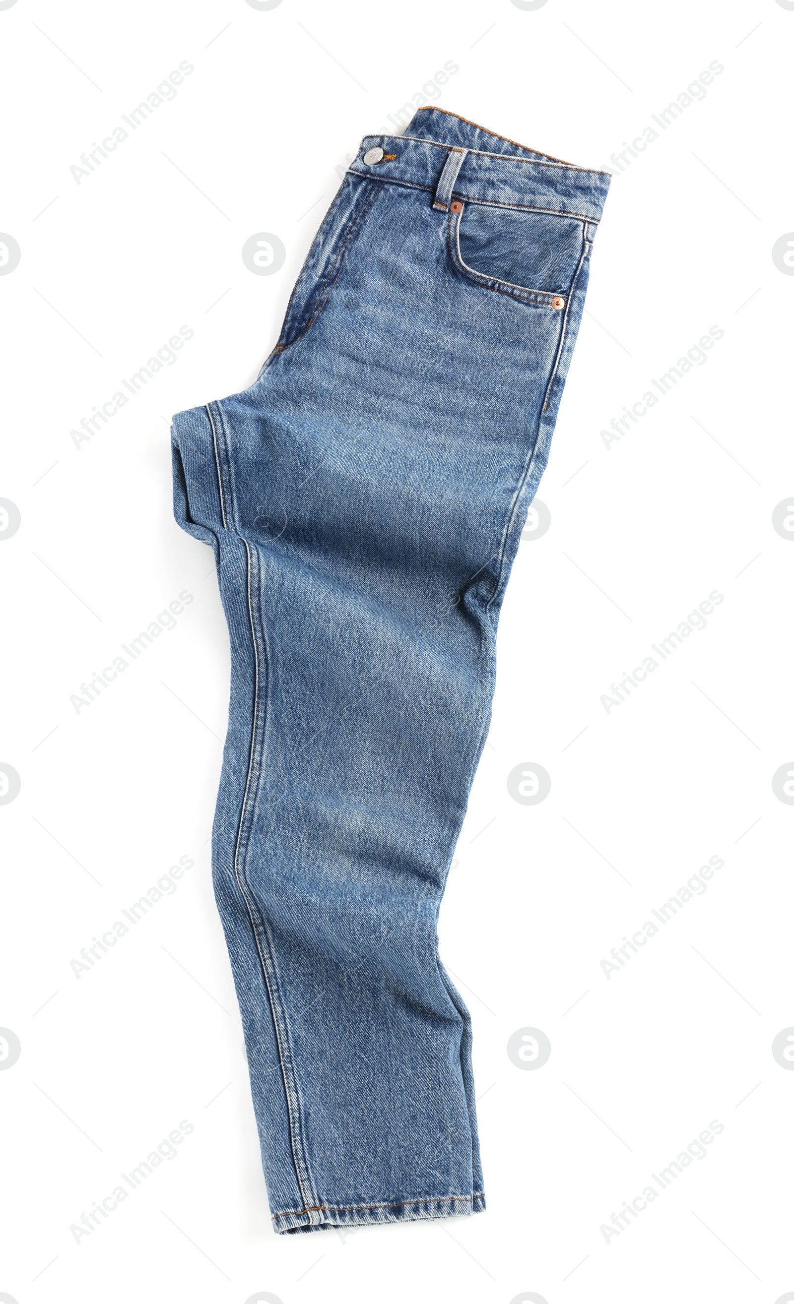 Photo of Rumpled blue jeans isolated on white, top view. Stylish clothes