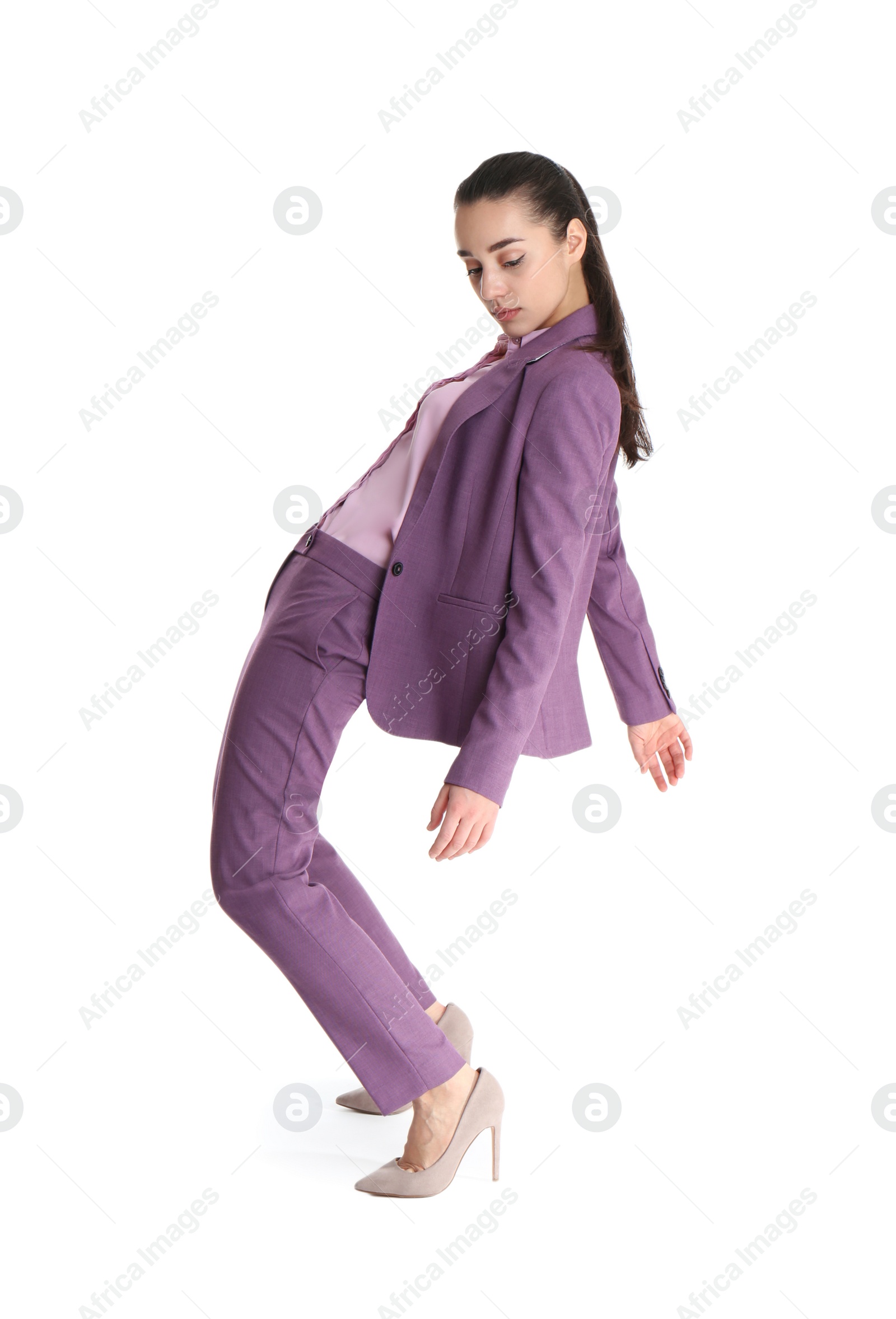 Photo of Businesswoman attracted to magnet on white background