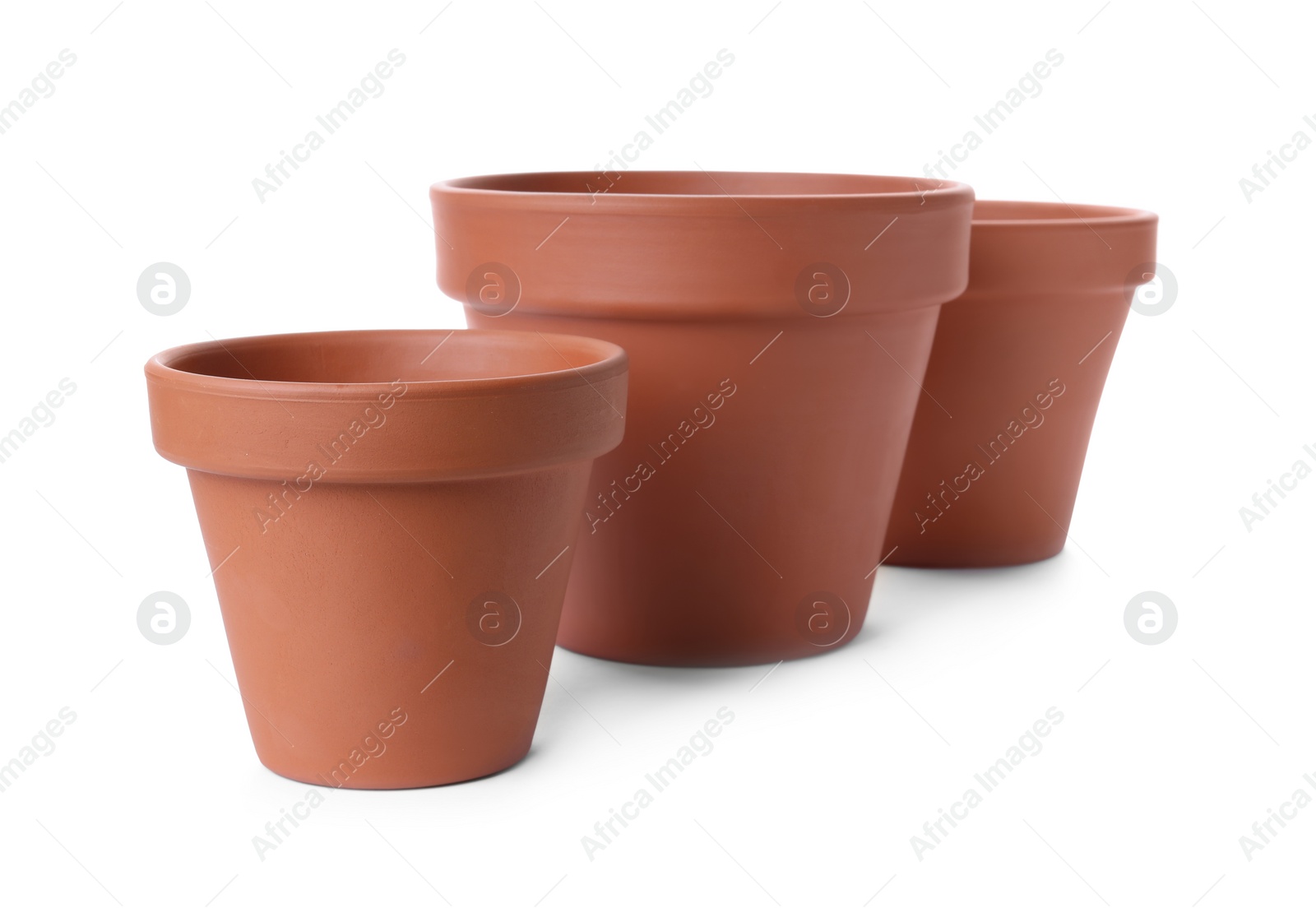 Photo of Stylish terracotta flower pots isolated on white