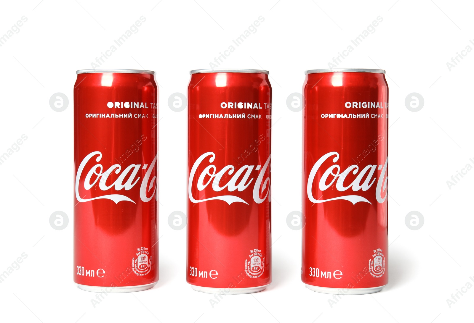 Photo of MYKOLAIV, UKRAINE - NOVEMBER 14, 2018: Coca-Cola cans on white background