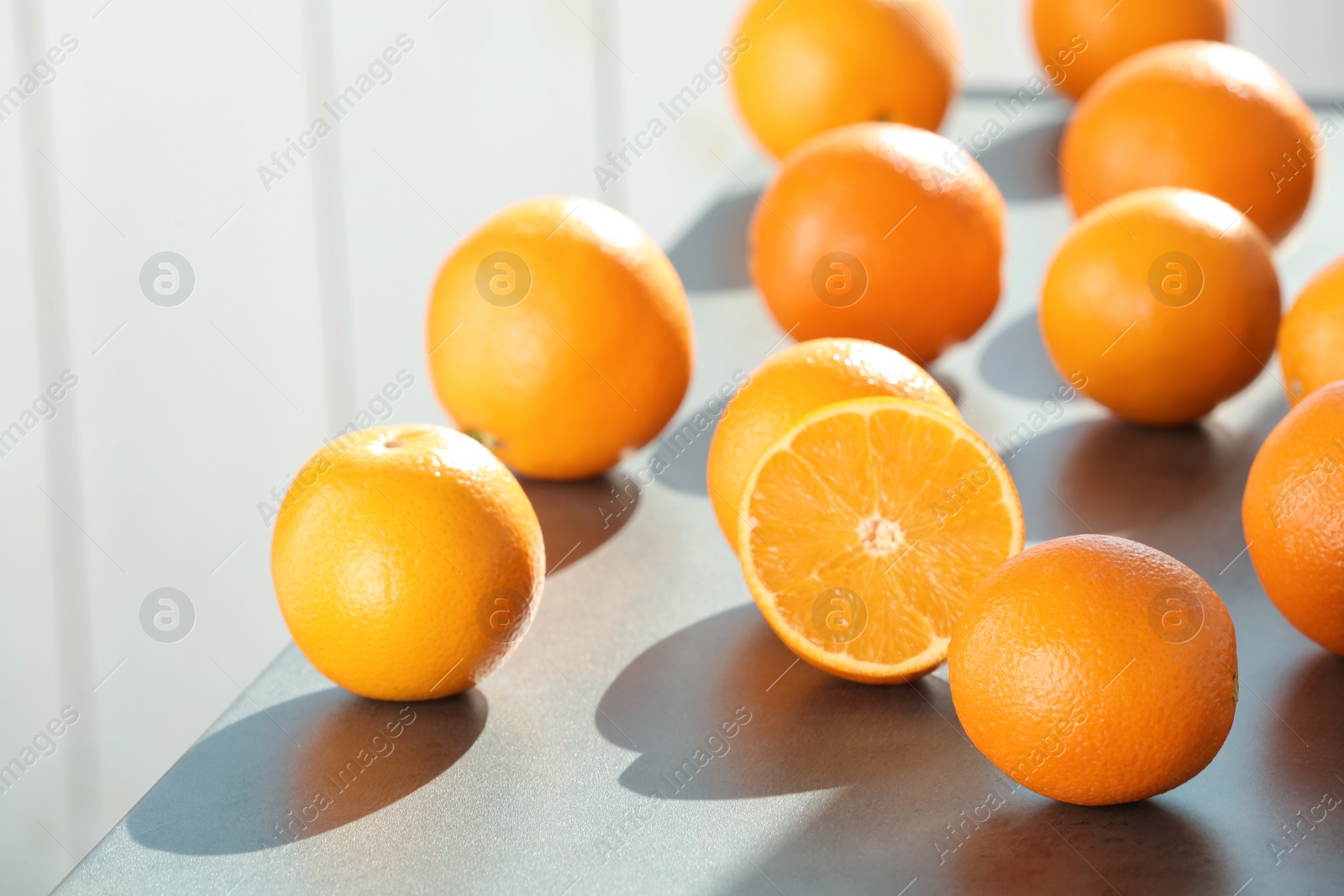 Photo of Fresh juicy oranges on table, space for text. Healthy fruits