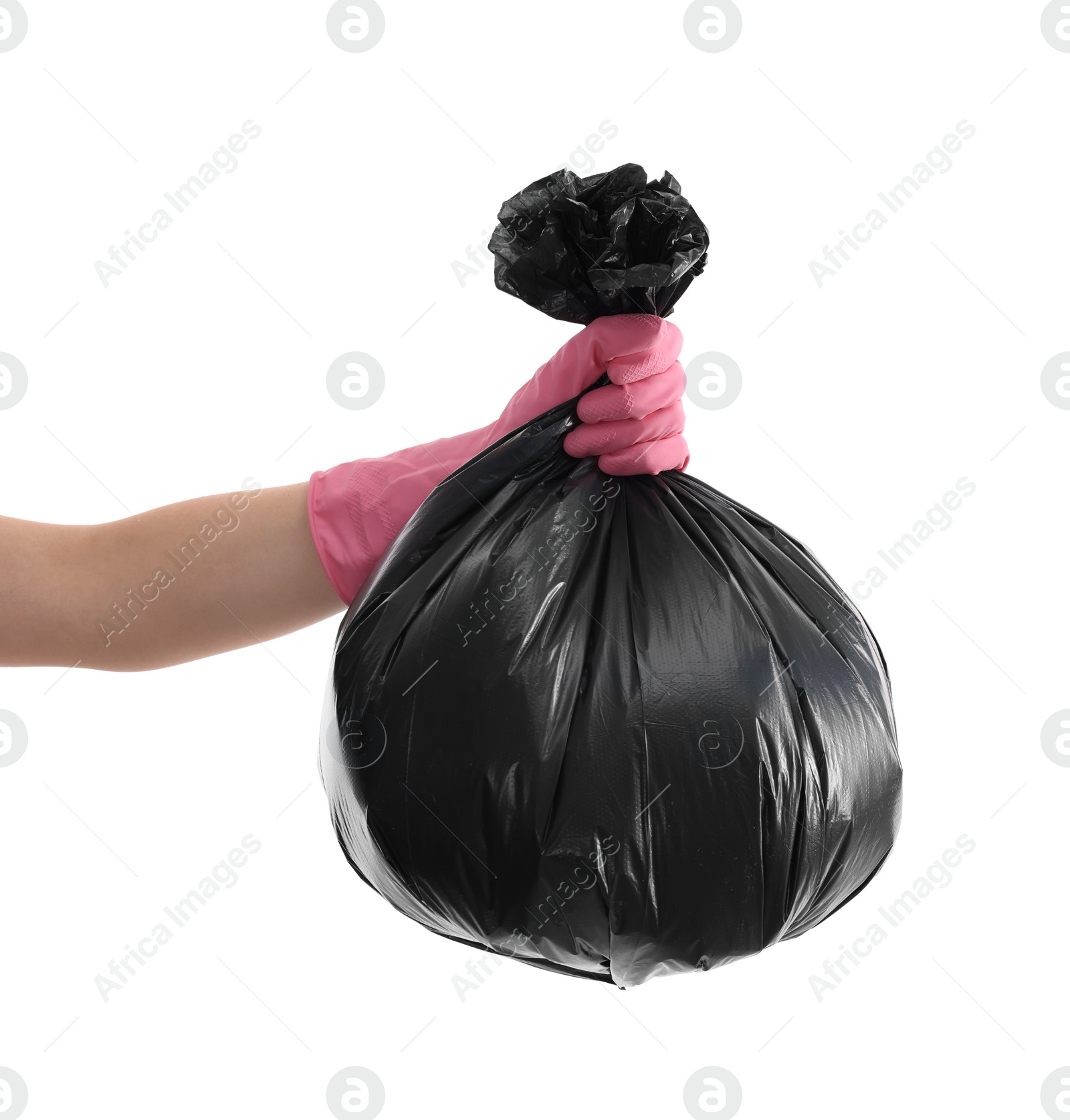 Photo of Woman holding plastic bag full of garbage on white background, closeup