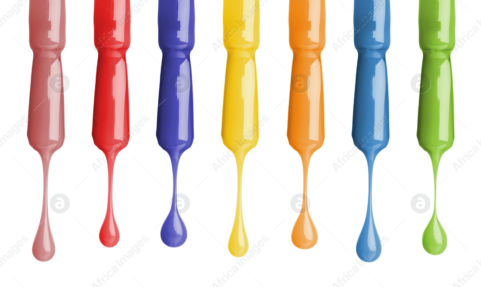 Image of Different color nail polish collection. Set of brushes with dripping liquid isolated on white