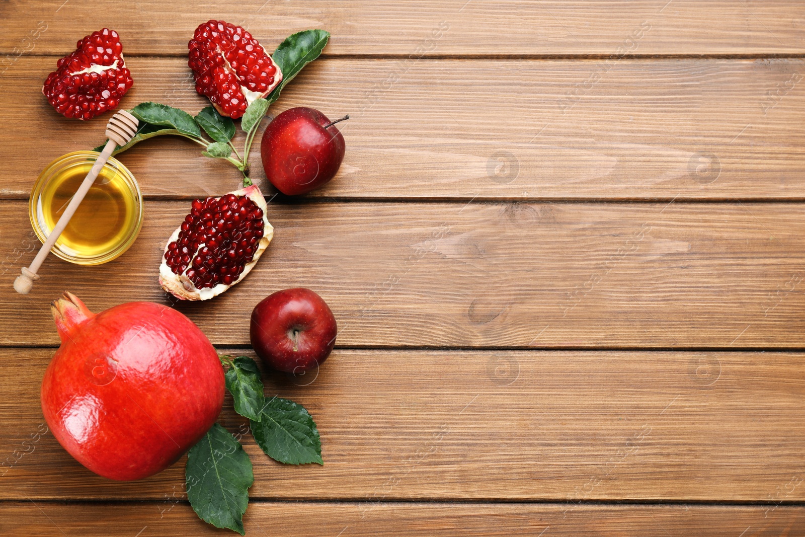 Photo of Flat lay composition with Rosh Hashanah holiday attributes on wooden table. Space for text