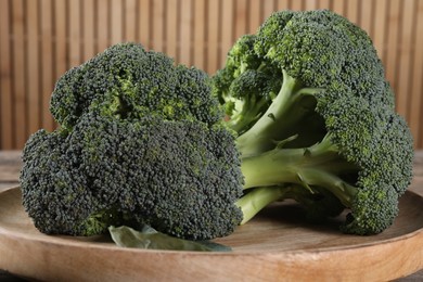 Photo of Fresh raw broccoli on table, closeup view