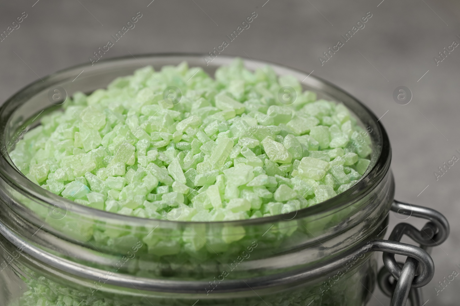 Photo of Jar with light green sea salt, closeup view