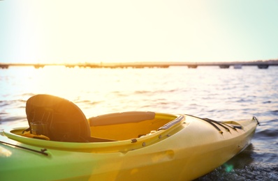 Yellow kayak on river, closeup. Summer camp activity