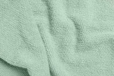 Photo of Soft crumpled towel as background, top view