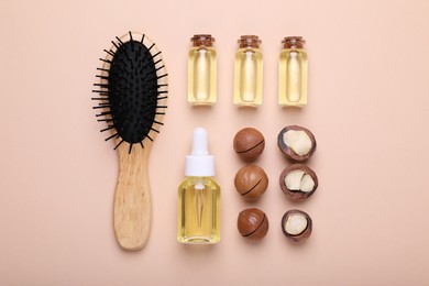 Photo of Delicious organic Macadamia nuts, cosmetic oil and brush on beige background, flat lay