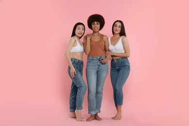 Portrait of beautiful young women on pink background