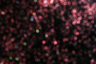 Photo of Color glitter on dark background. Bokeh effect
