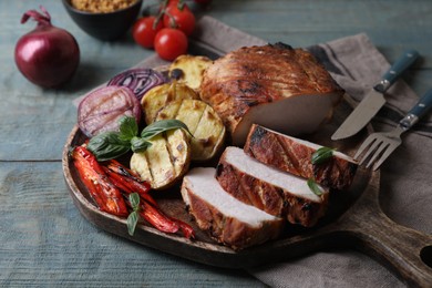 Photo of Delicious grilled meat and vegetables served on wooden table, closeup