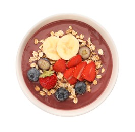 Photo of Delicious smoothie bowl with fresh berries, banana and granola on white background, top view