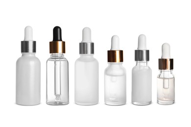 Serums in different bottles isolated on white, collection