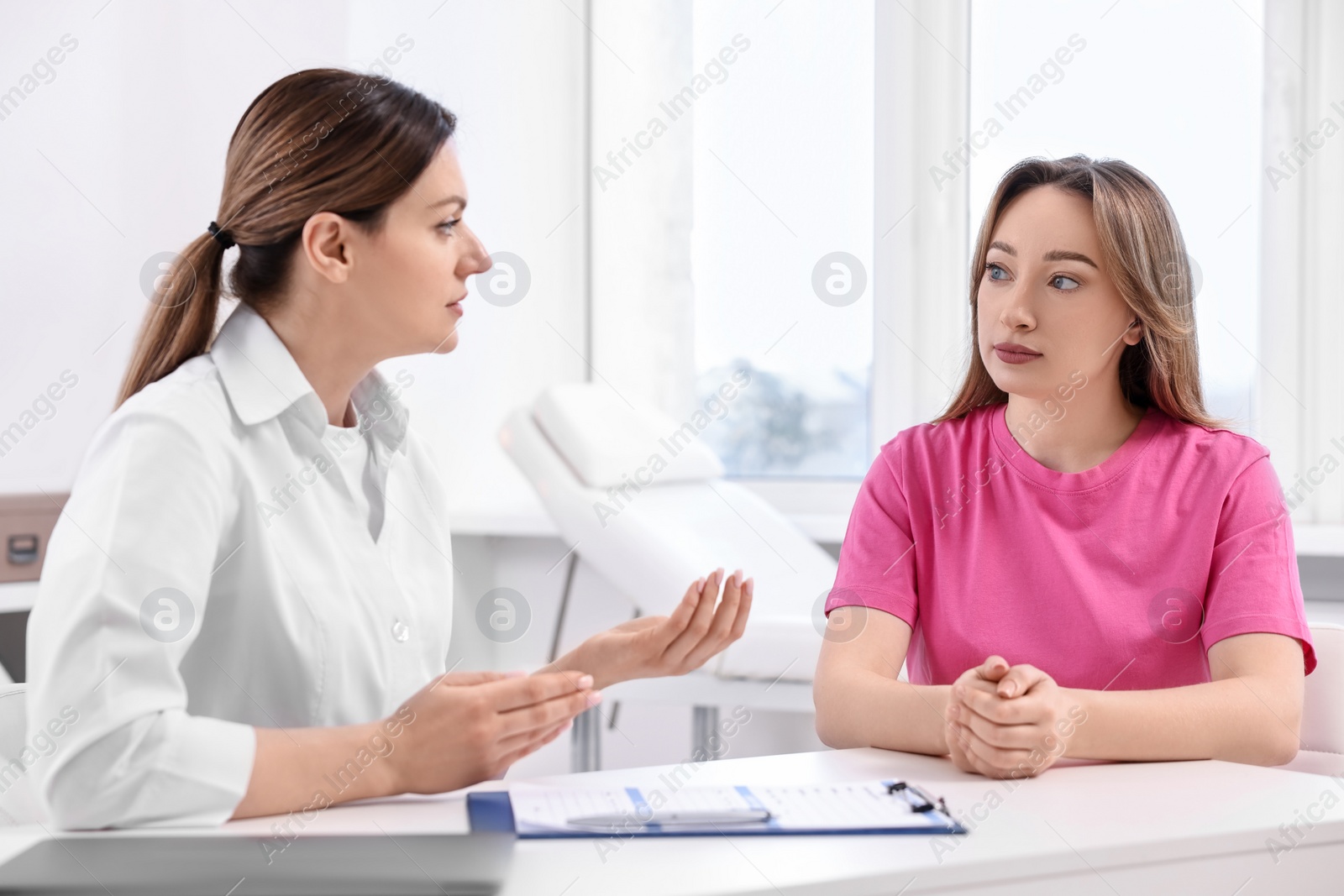 Photo of Mammologist consulting woman during appointment in hospital