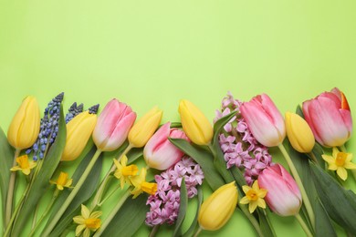 Photo of Beautiful different flowers on green background, flat lay. Space for text