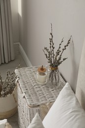 Bedroom interior with pussy willow branches and other decor