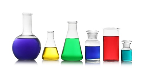 Photo of Different glassware with samples on white background. Solution chemistry