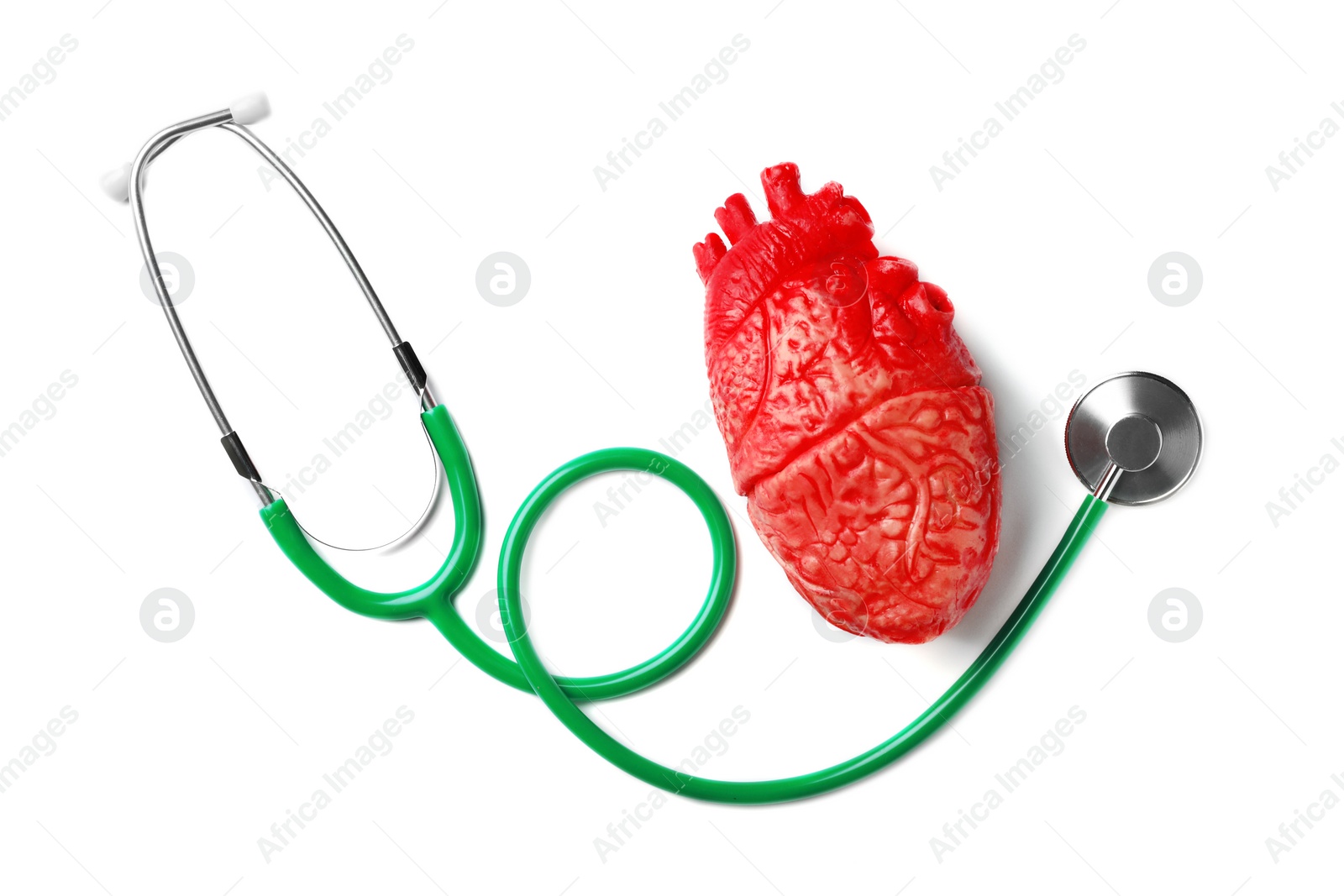 Photo of Stethoscope for checking pulse and heart model on white background, top view