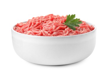 Photo of Raw ground meat and parsley in bowl isolated on white