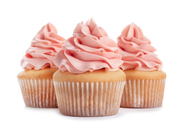 Delicious cupcakes with cream on white background