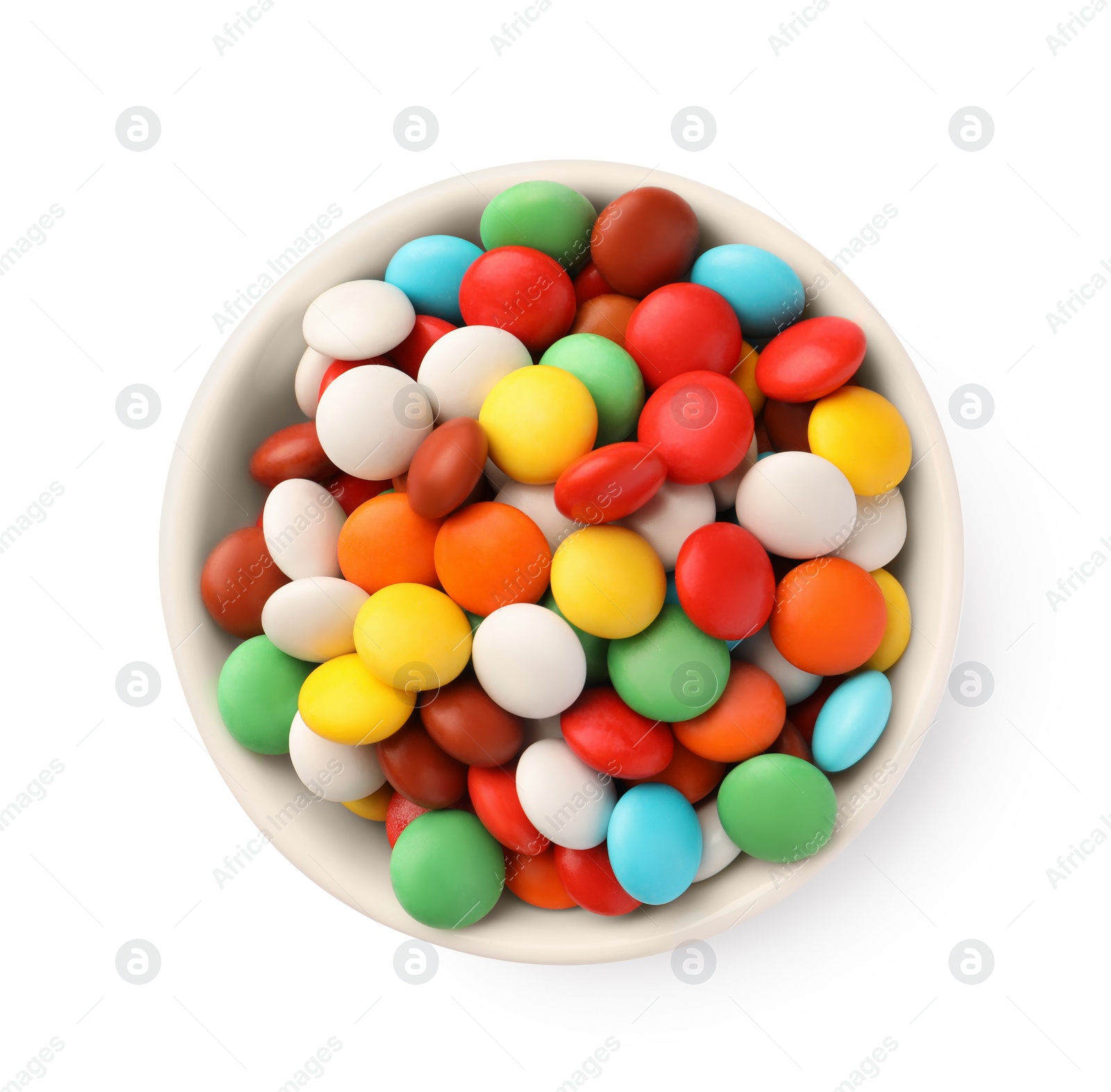 Photo of Bowl with colorful candies isolated on white, top view