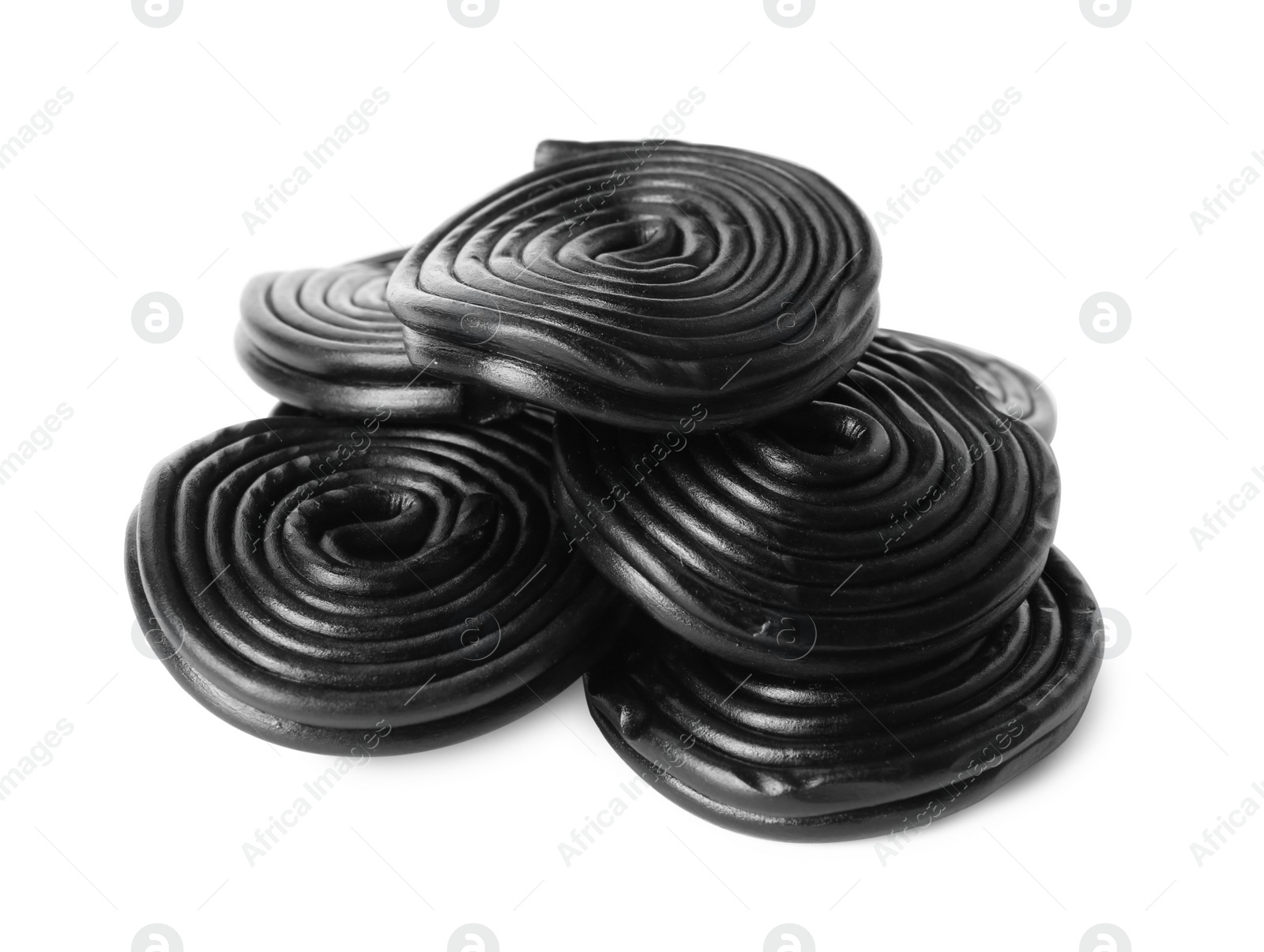 Photo of Tasty black liquorice candies on white background