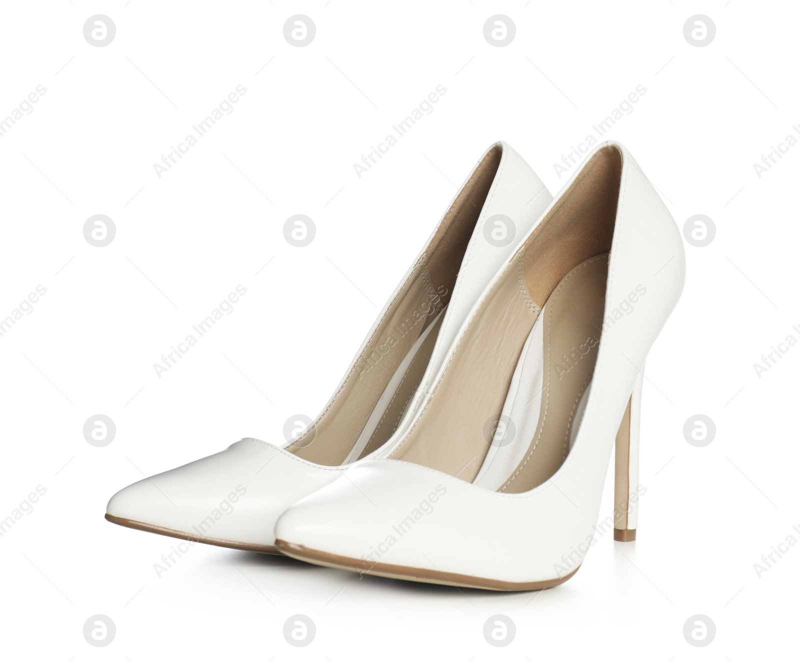 Photo of Beautiful classic wedding shoes on white background