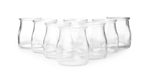 Photo of Empty clear glass jars isolated on white