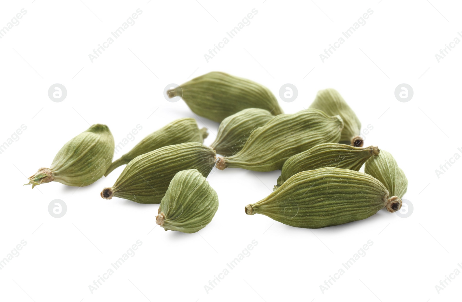 Photo of Pile of dry green cardamom pods on white background