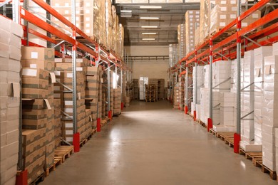 Image of Warehouse with lots of boxes on racks. Wholesale business