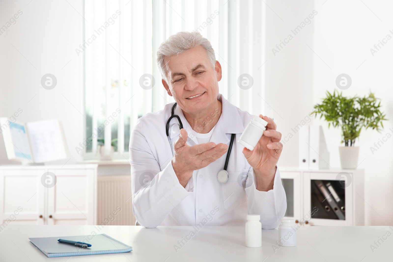 Photo of Doctor consulting patient using video chat in clinic, view from web camera