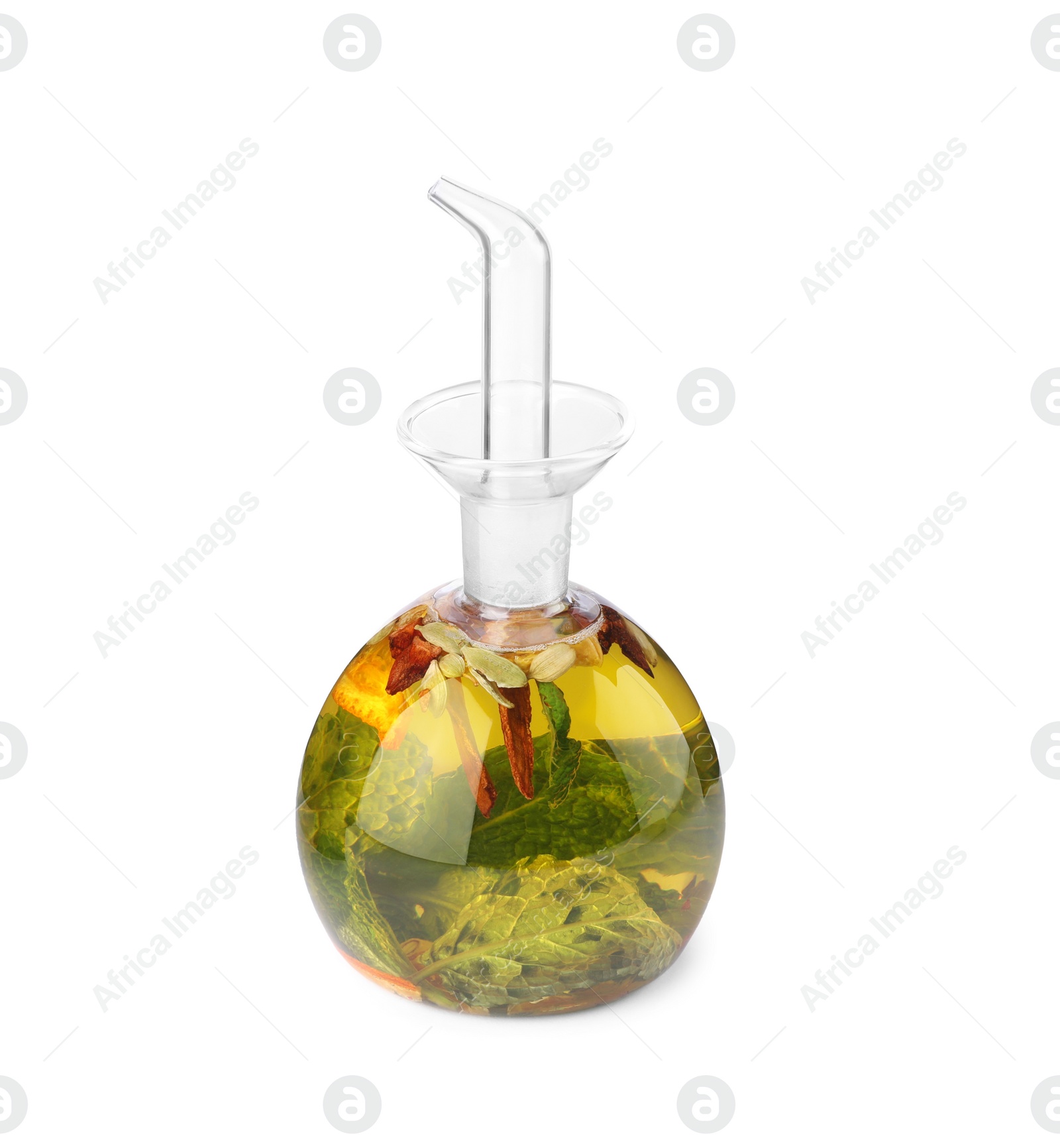 Photo of Glass bottle of cooking oil with spices and herbs isolated on white