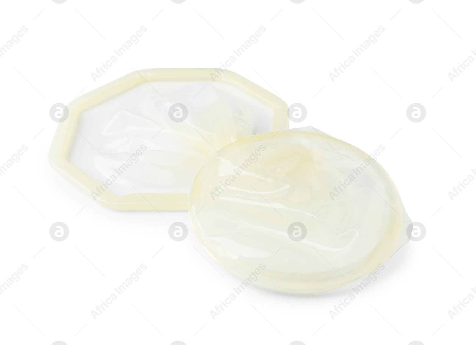 Photo of Unrolled female condom isolated on white. Safe sex