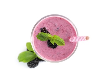 Photo of Delicious blackberry smoothie in glass on white background, top view