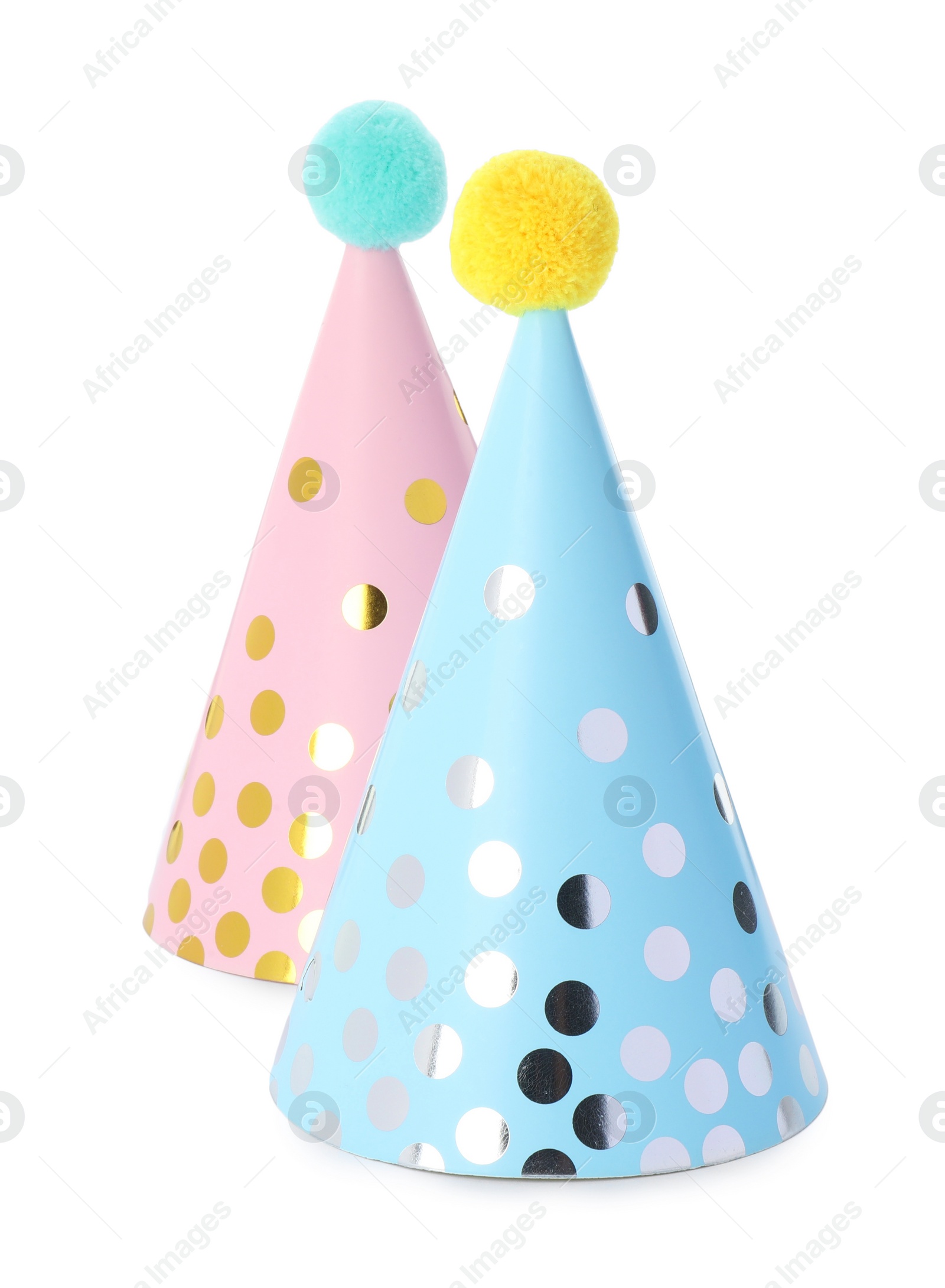 Photo of Two colorful party hats with pompoms isolated on white