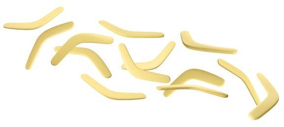 Image of Many yellow boomerangs flying on white background. Banner design