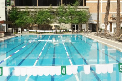 Photo of View on swimming pool and building at luxury resort