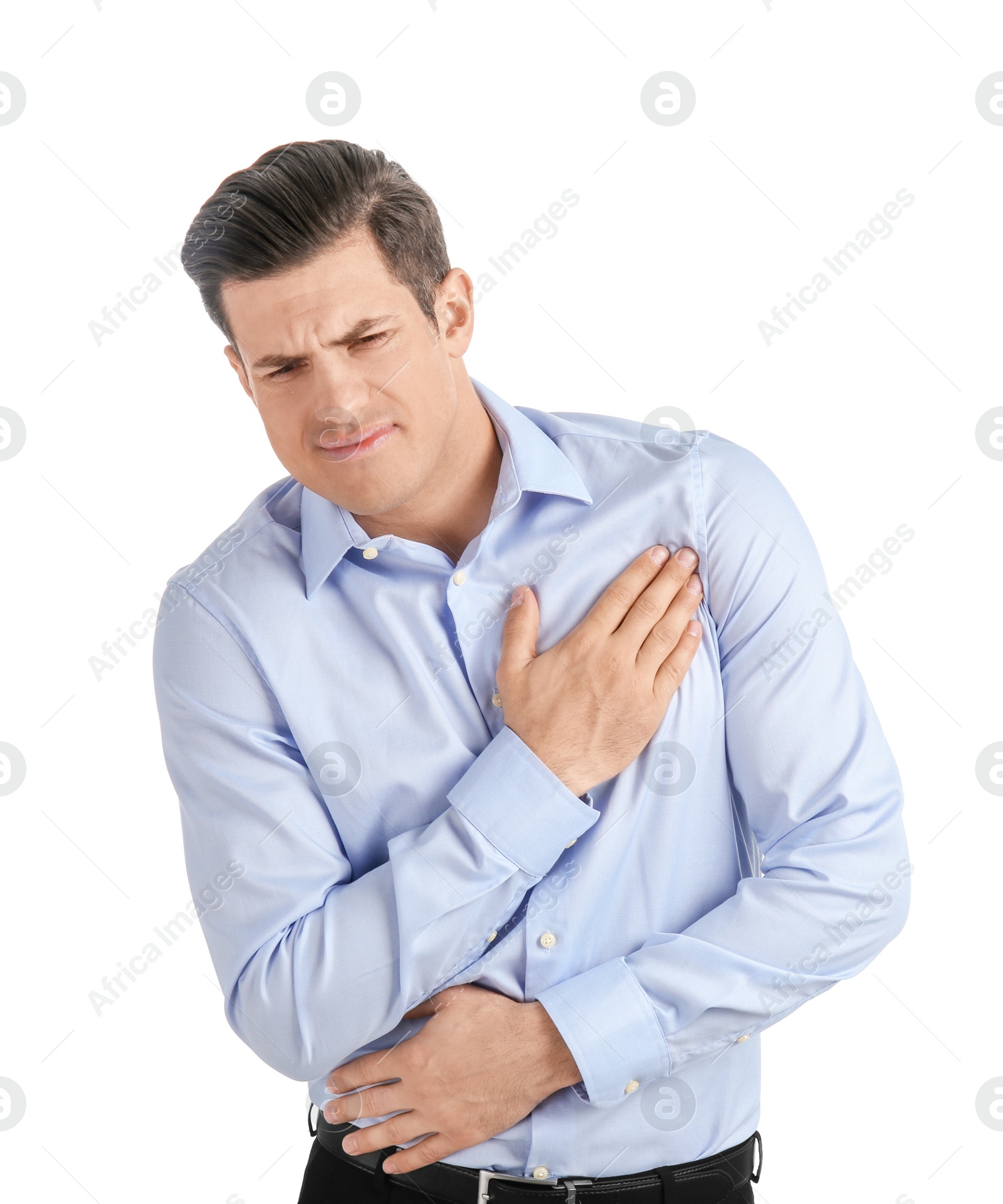 Photo of Young man suffering from chest pain on white background