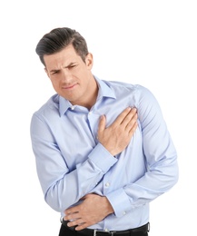 Young man suffering from chest pain on white background