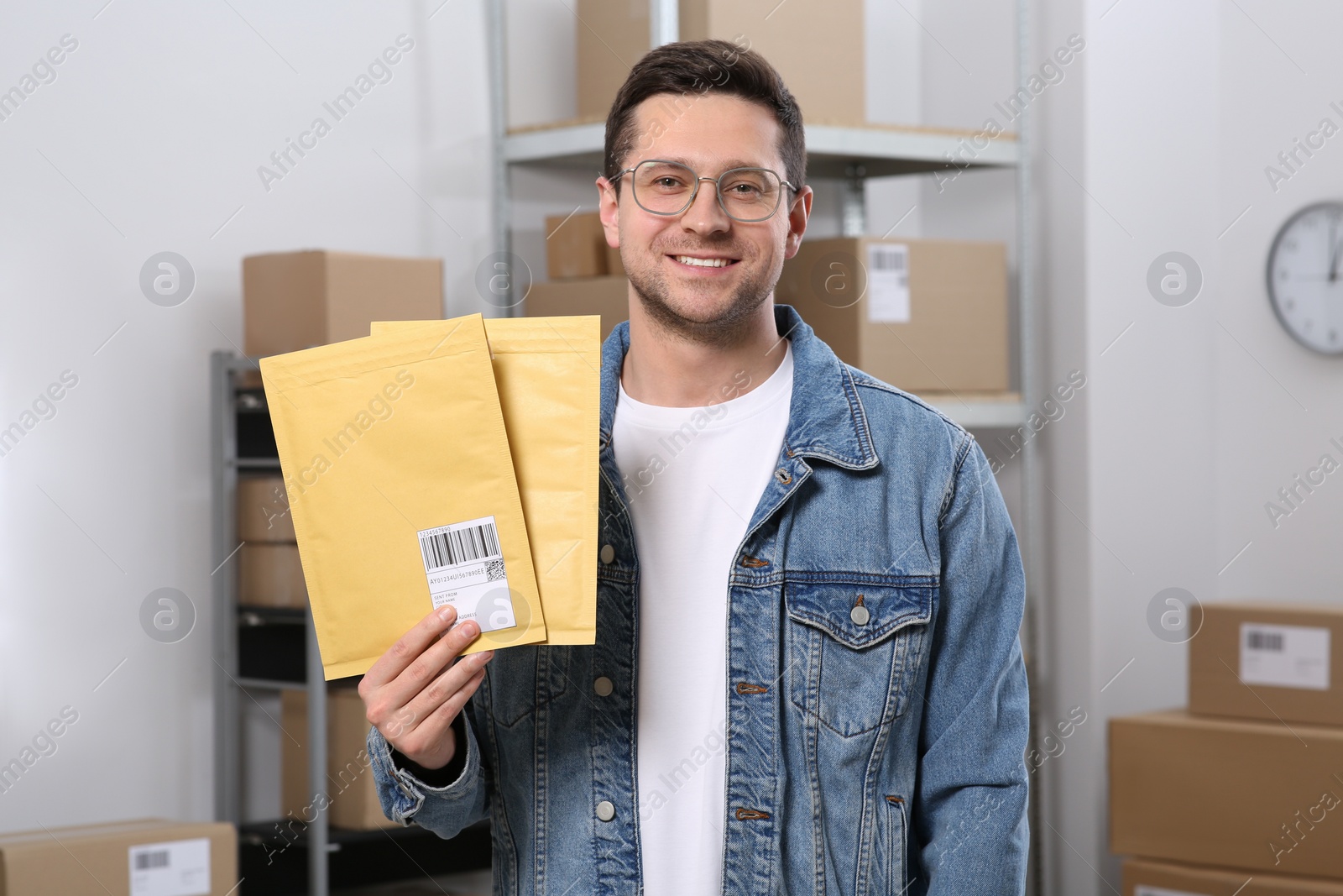 Photo of Seller with parcels in office. Online store