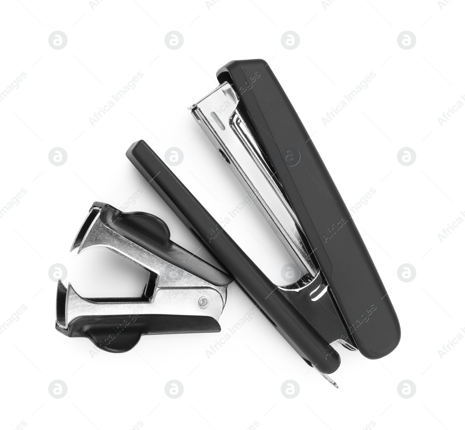 Photo of Black stapler and staple remover isolated on white, top view