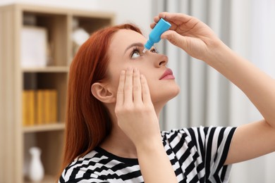 Woman applying medical eye drops at home