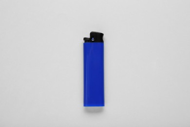 Stylish small pocket lighter on white background, top view
