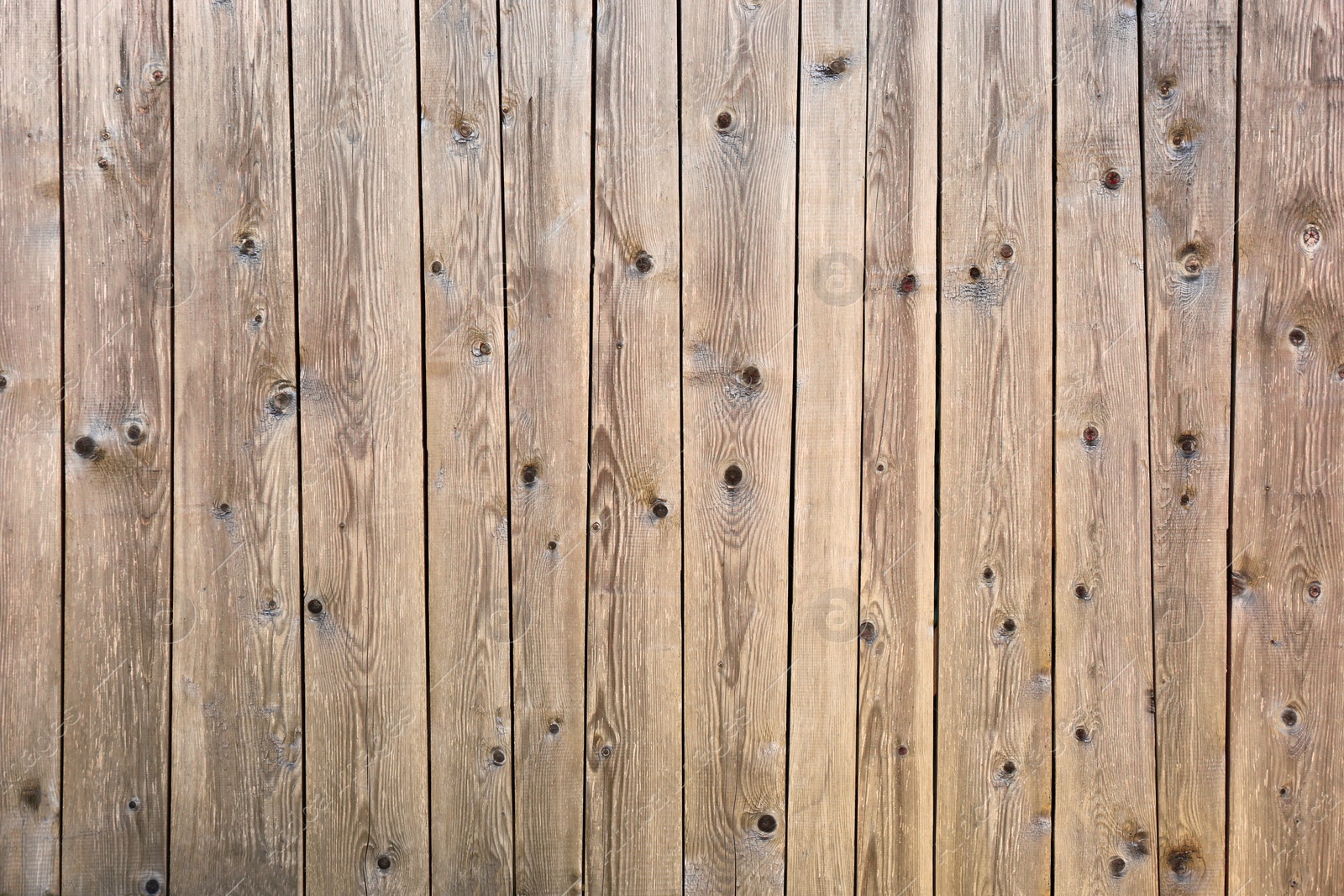 Photo of Row of wooden planks as background, fence texture