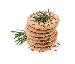 Photo of Stack of round cereal crackers with flax, sunflower, sesame seeds and rosemary isolated on white