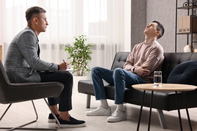 Professional psychotherapist working with patient in office