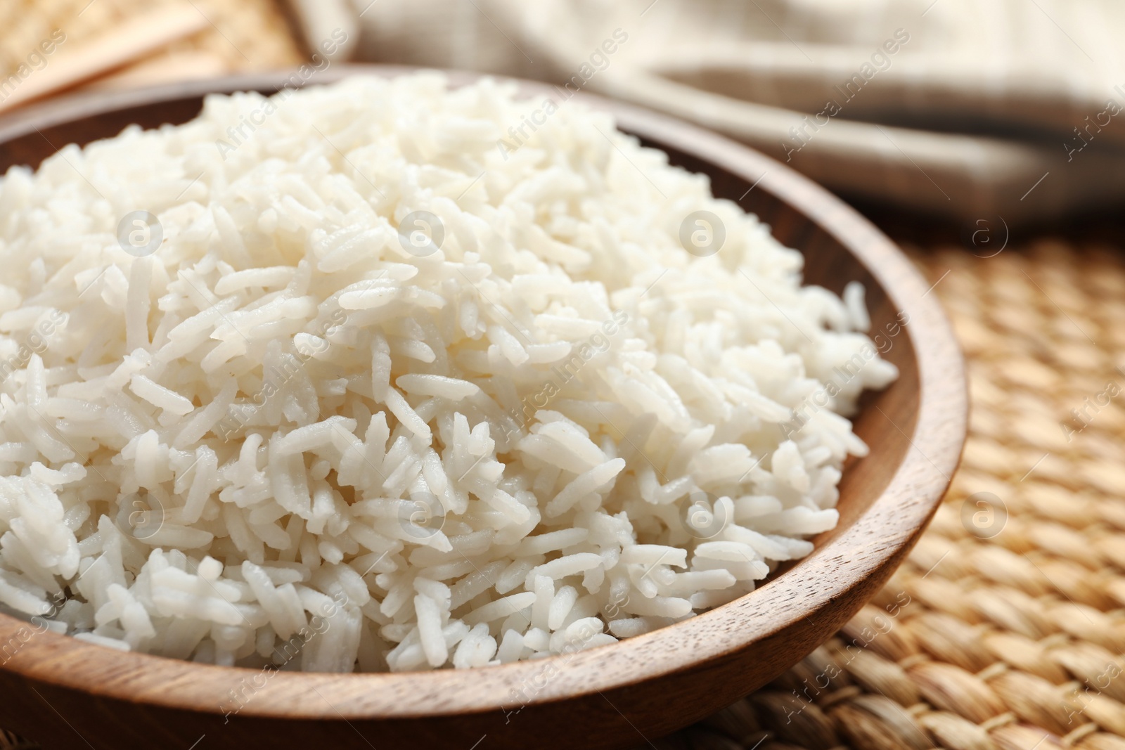 Photo of Plate of tasty cooked white rice on table, closeup