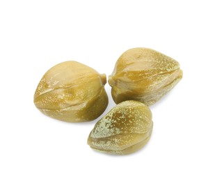 Three delicious pickled capers on white background, top view