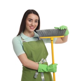 Beautiful young woman with broom on white background